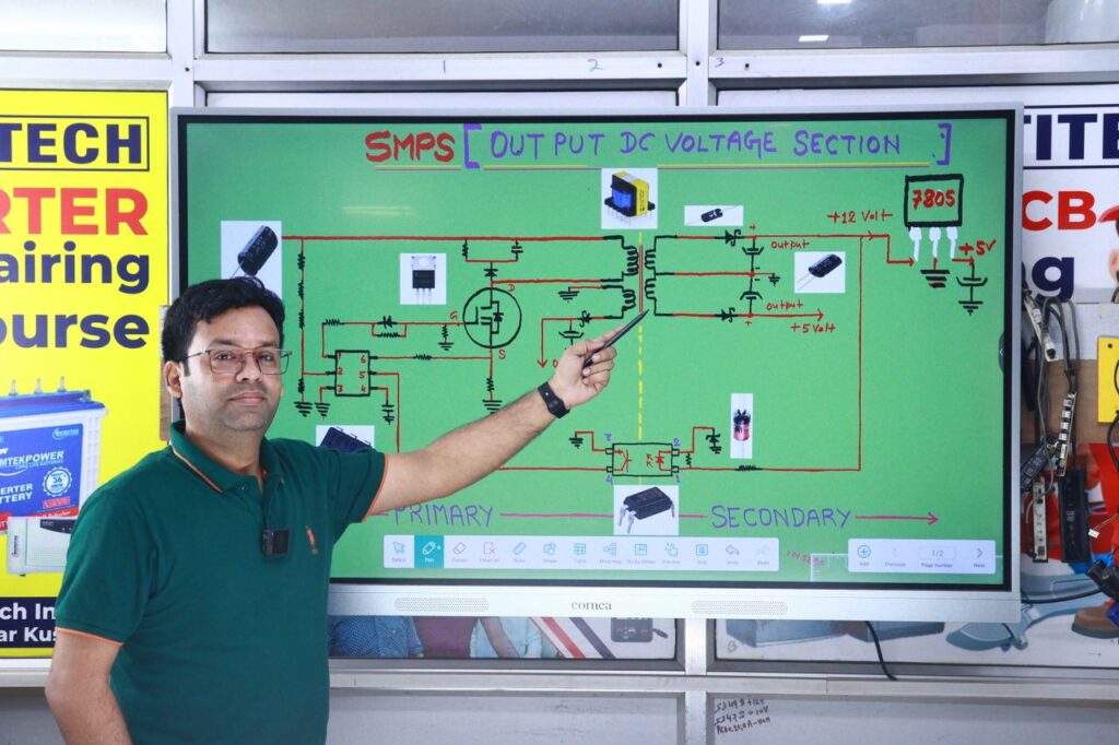 Instructor explaining SMPS voltage section diagram during AC repair course in New Delhi.